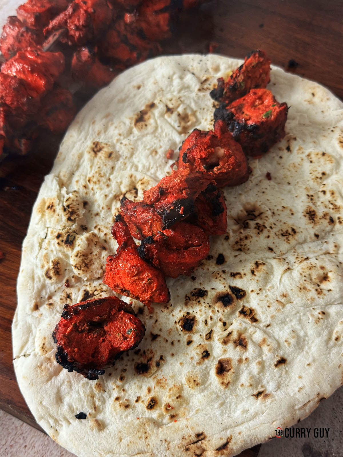 The light chicken tikka on a naan.