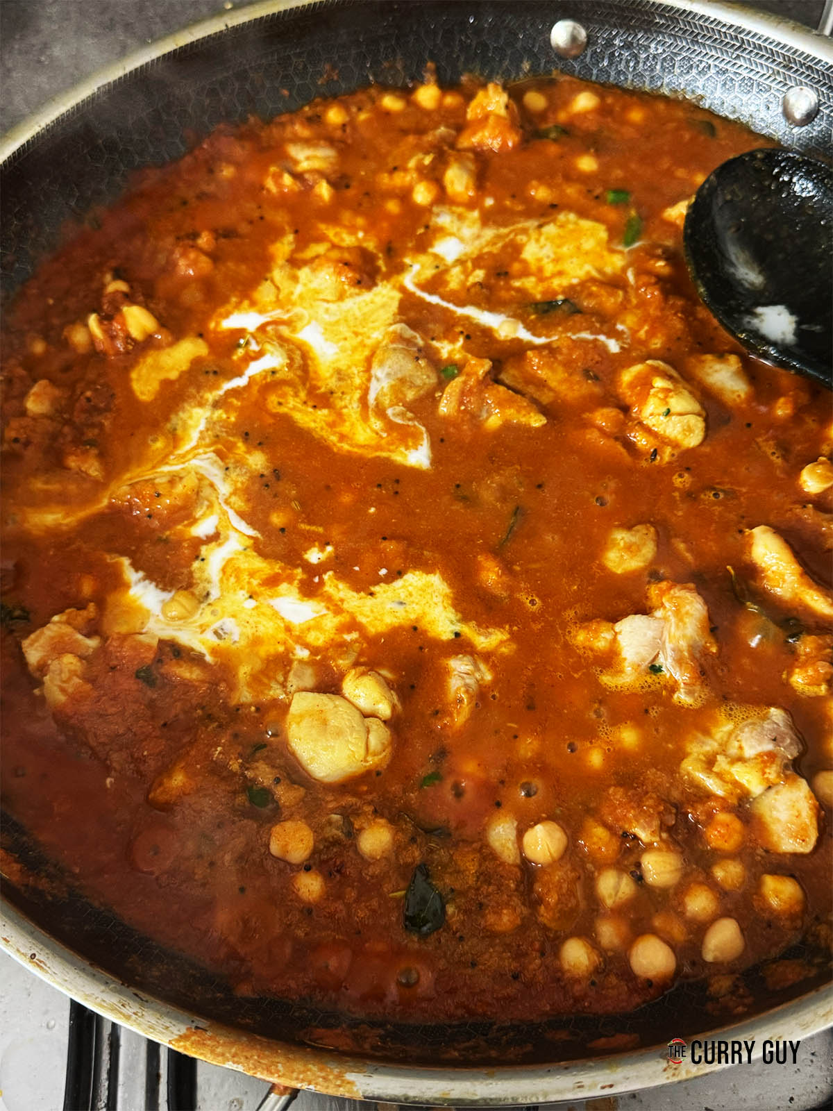 Stirring in the coconut milk and seasoning with salt to taste.