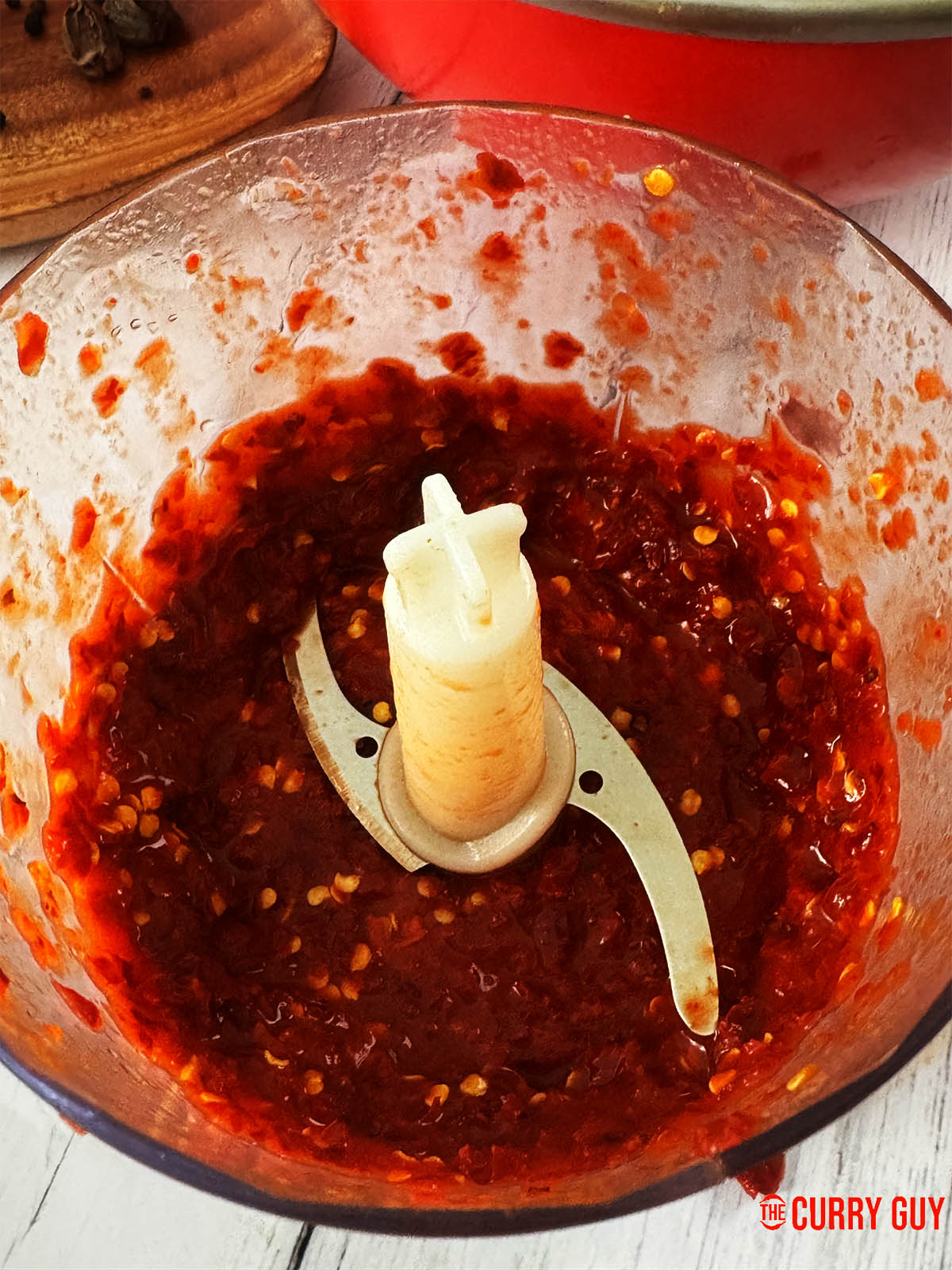 Blending the soaked Mathania chillies into a paste.