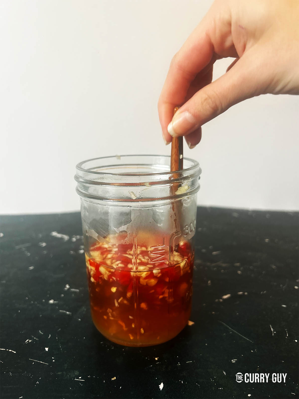 Stirring the Nuoc Cham together.