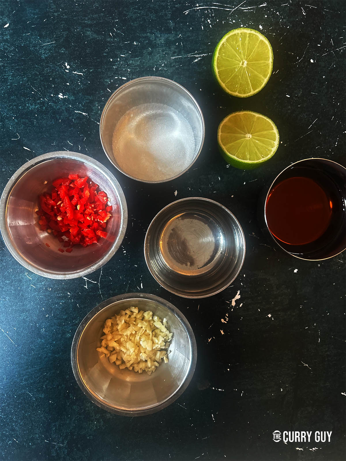 The ingredients for Nuoc Cham on a counter top ready to mix.