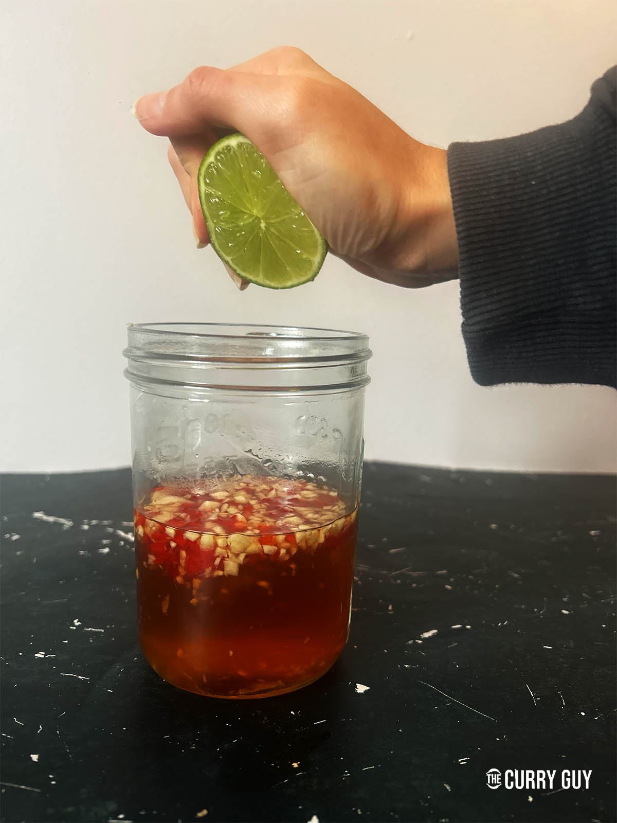 All of the ingredients for the Nuoc Cham in a jar.