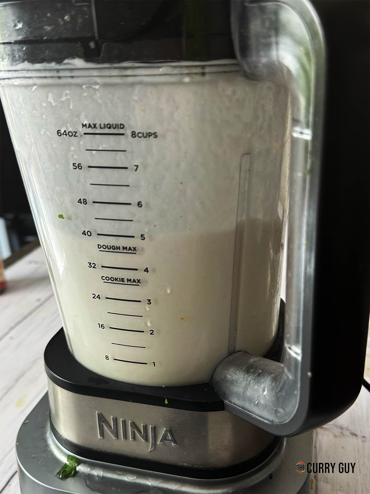 Blending the soaked rice in a blender until smooth.