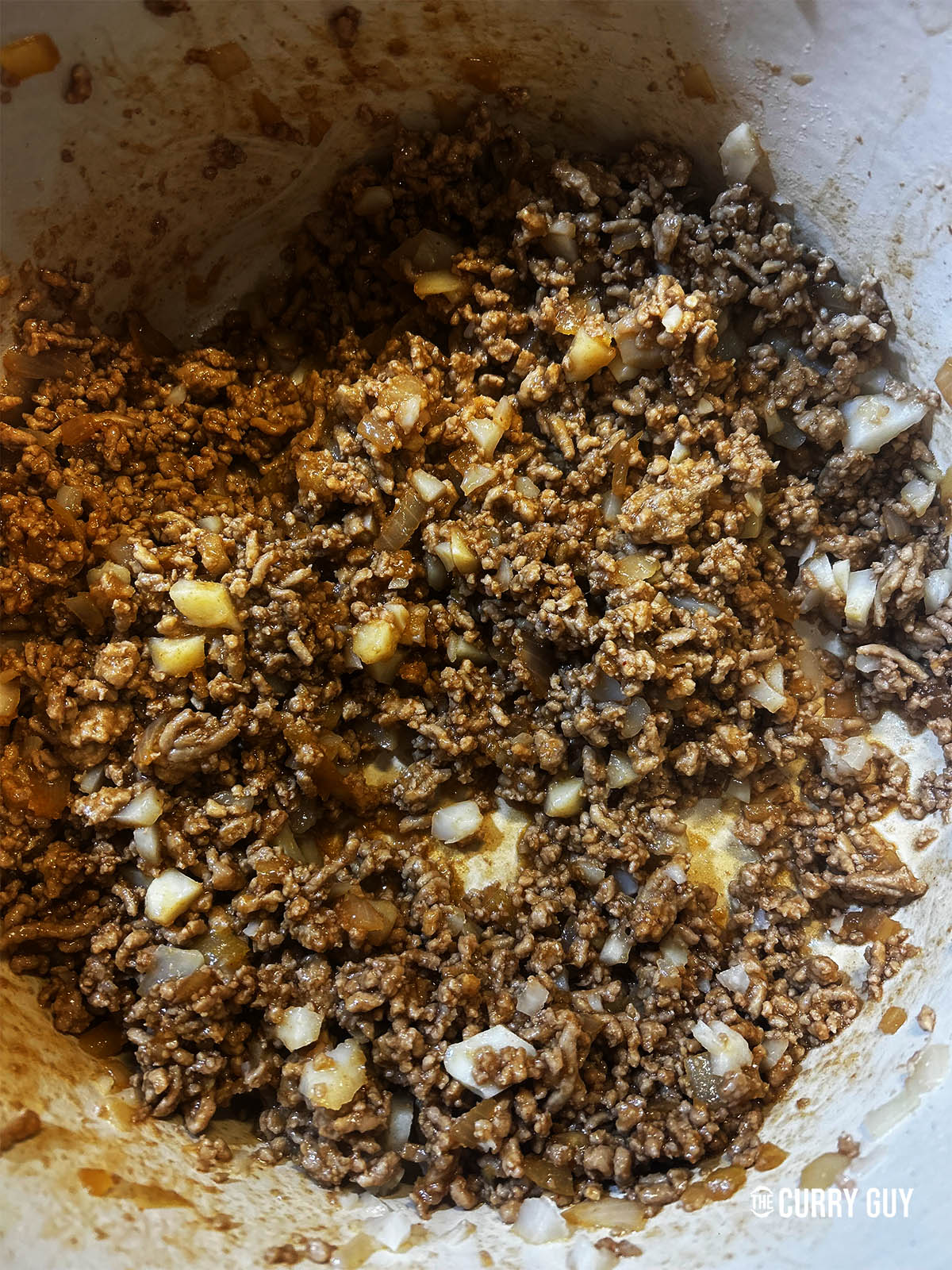 Stirring the water chestnuts into the meat.