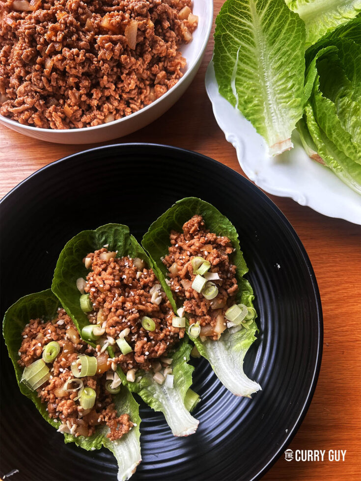 pork lettuce wraps on a serving plate.