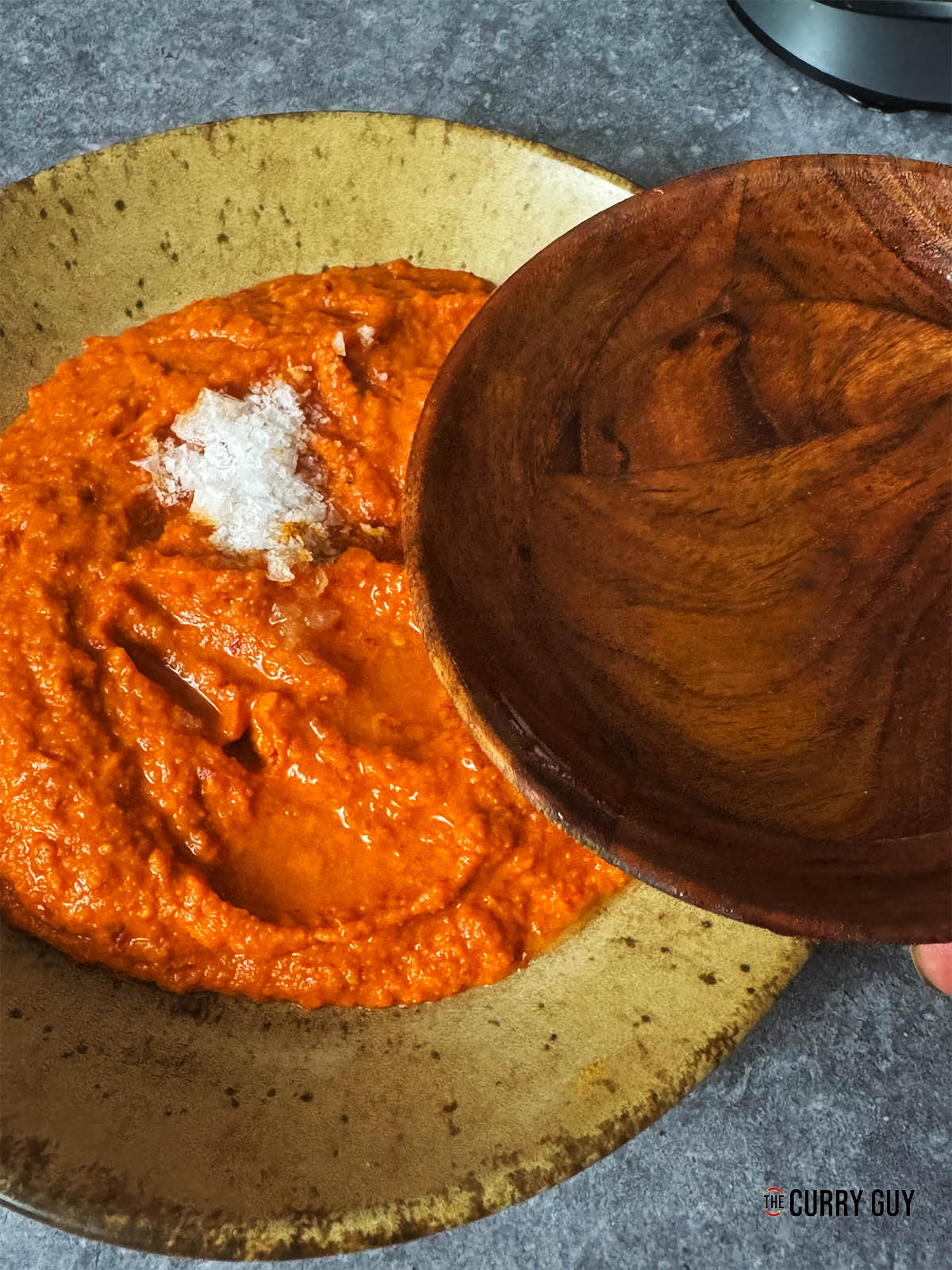 Adding salt and water to the paste.