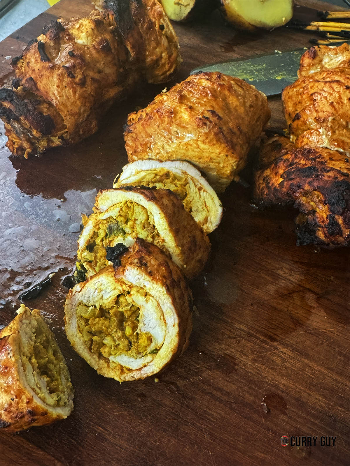 Sliced, stuffed chicken roulades.