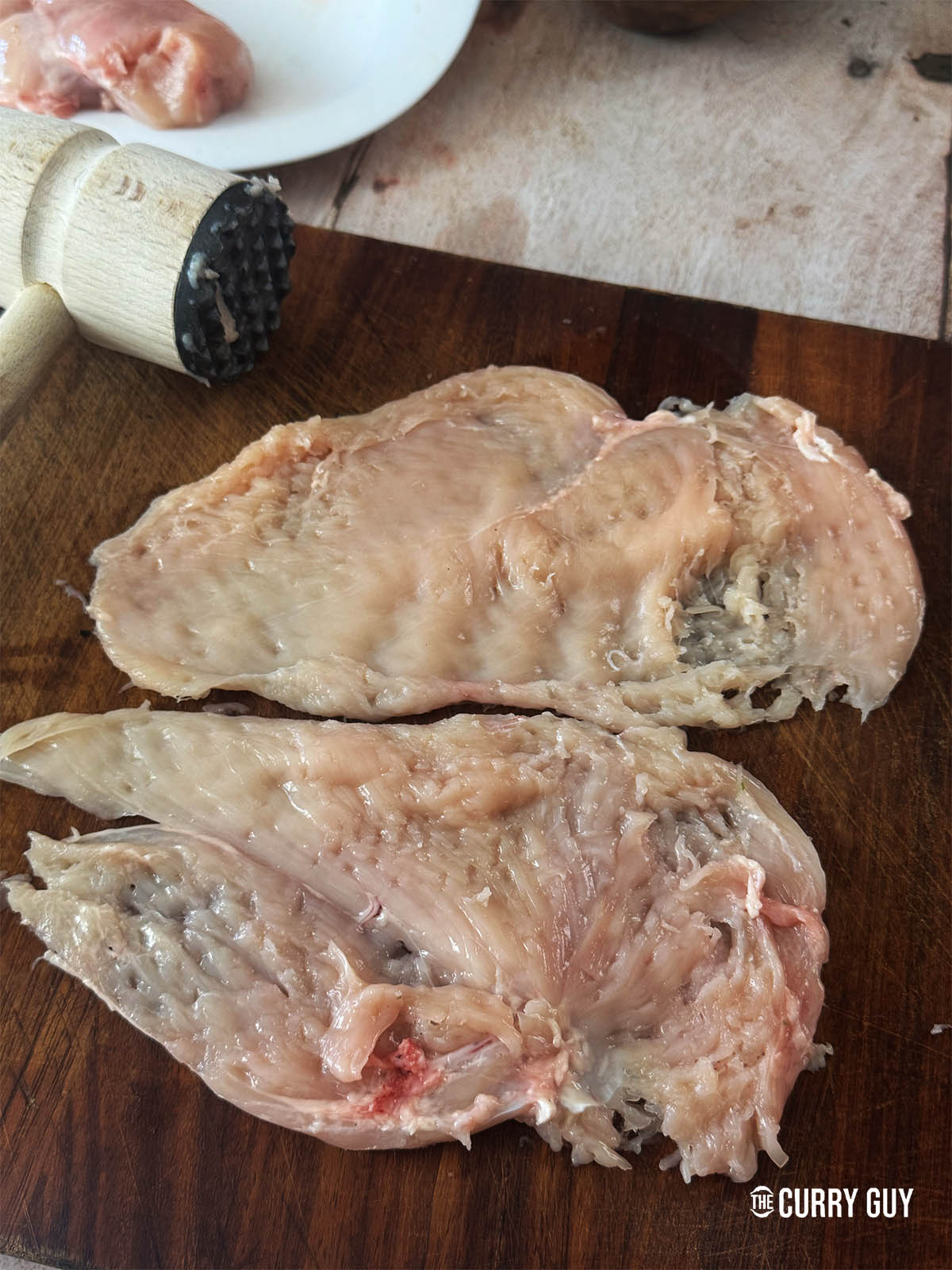 The pounded chicken breast pieces ready for the marinade.