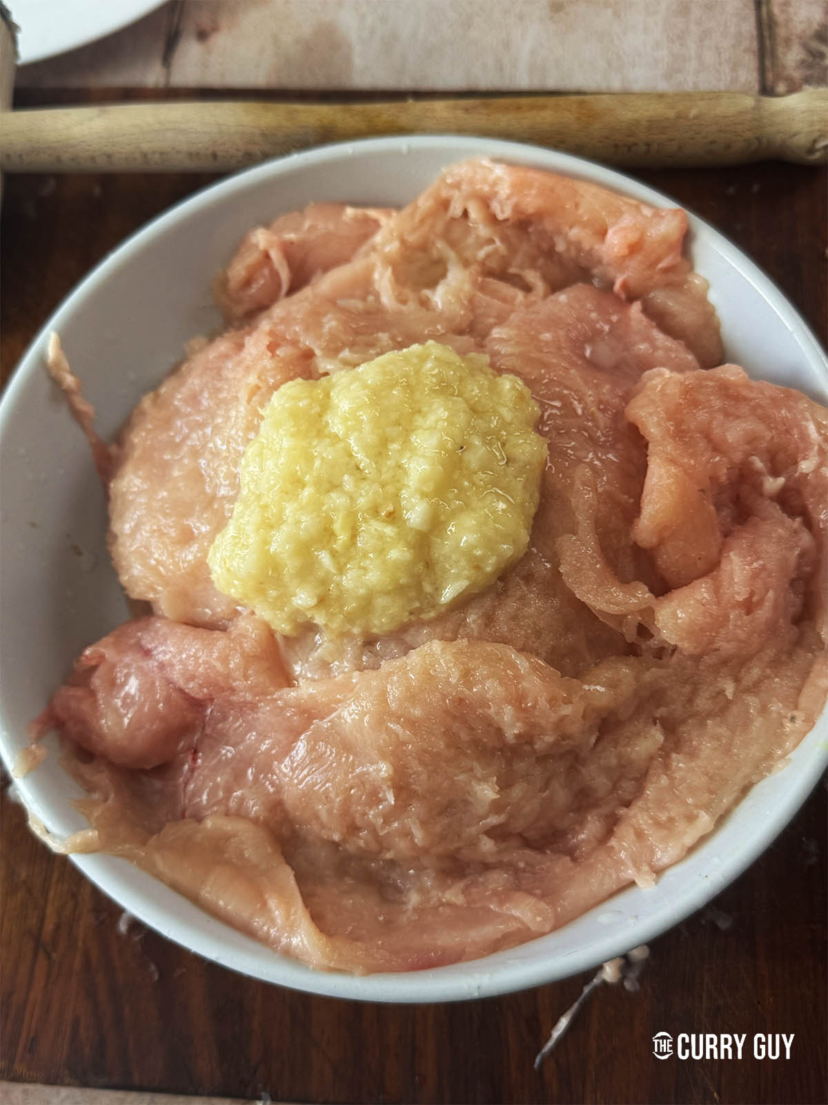The chicken marinating in the first marinade of garlic and ginger paste, salt and lime or lemon juice.