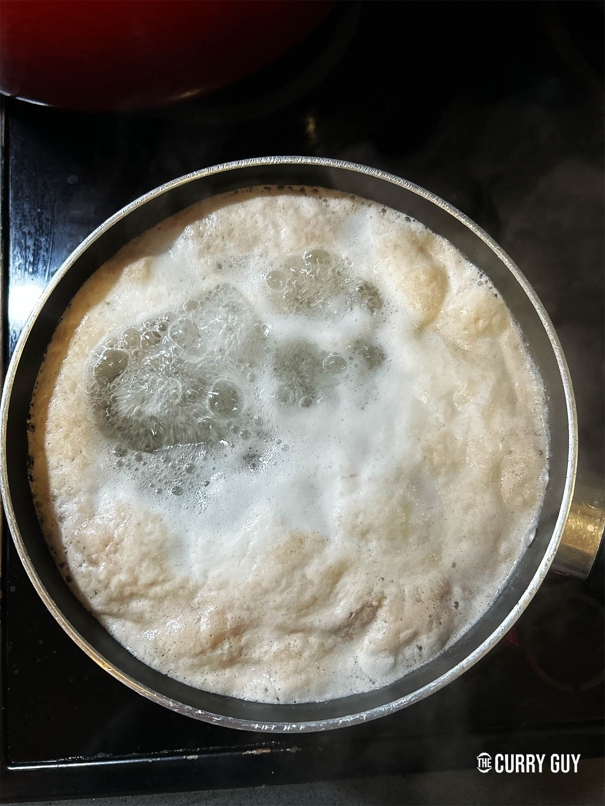 Boing the pork belly and skimming off the foam