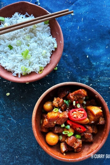 Thit Kho tao in a serving bowl next to a bowl of rice.