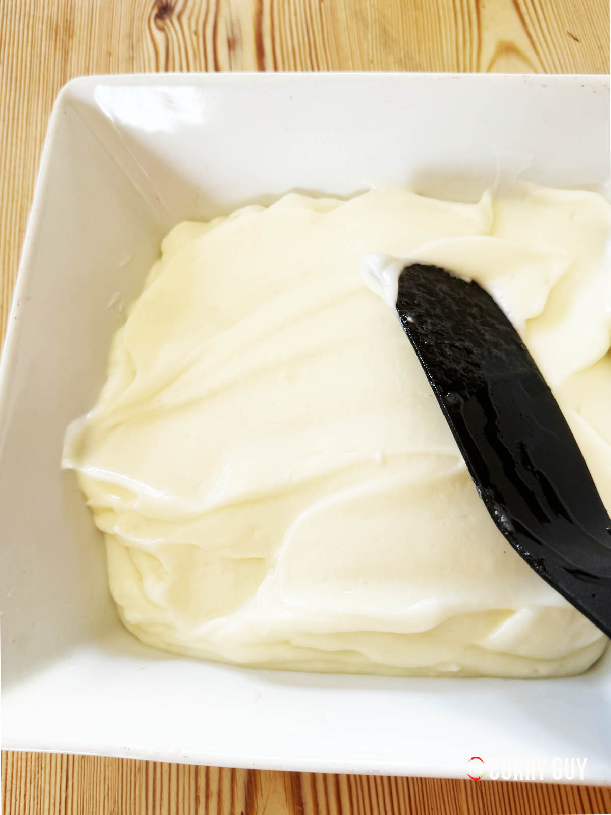 Pour the garlic sauce into a bowl for serving or storage. You can flatten it out some to stop the top from discolouring.