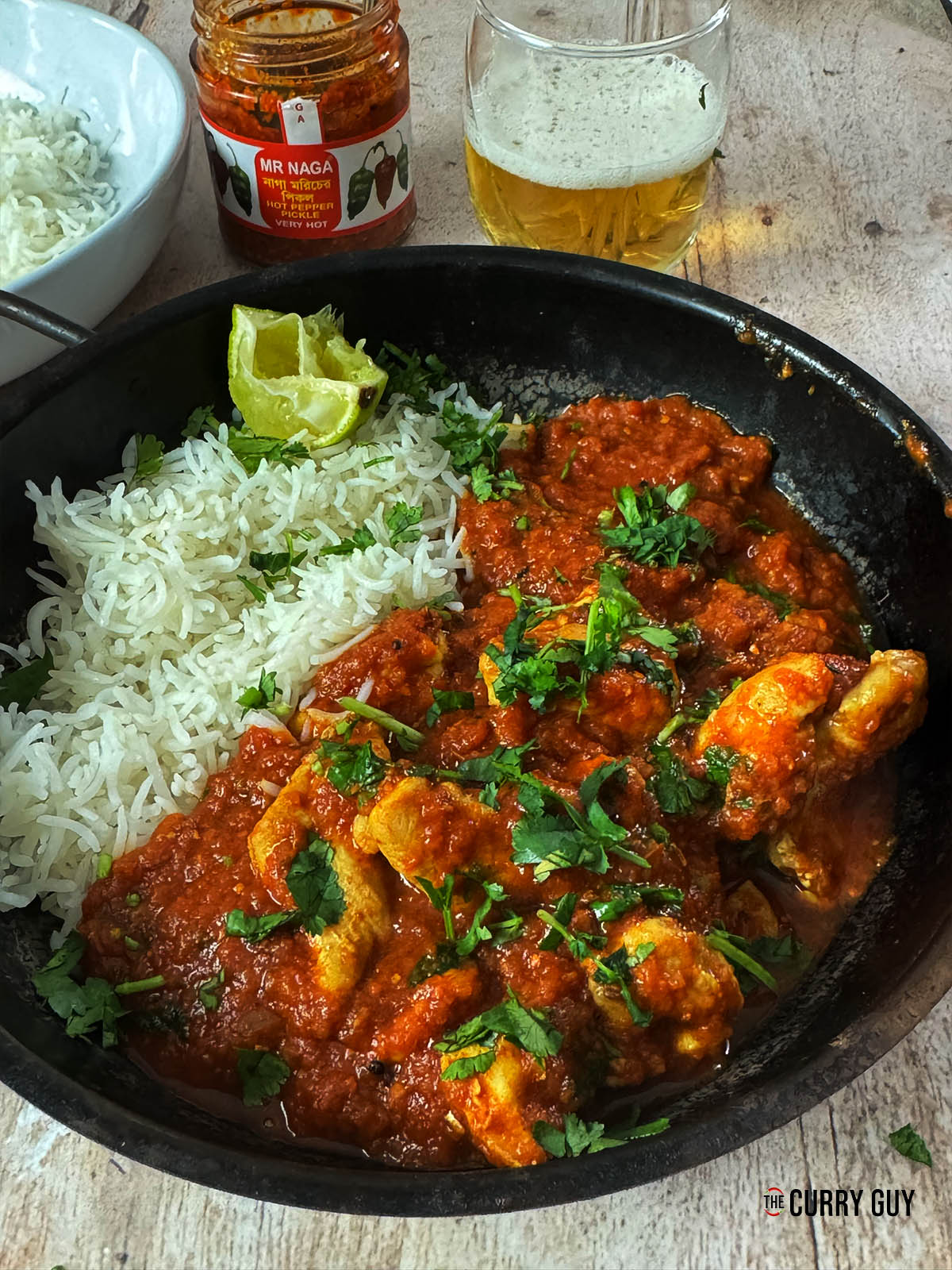 Naga Chicken Curry in a serving bowl with rice.