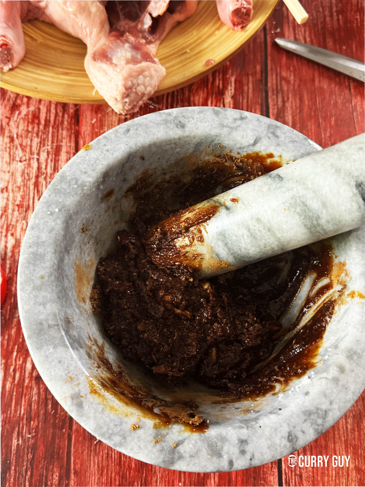 Mixing the hoisin sauce, brown sugar, five spice, salt and pepper together.