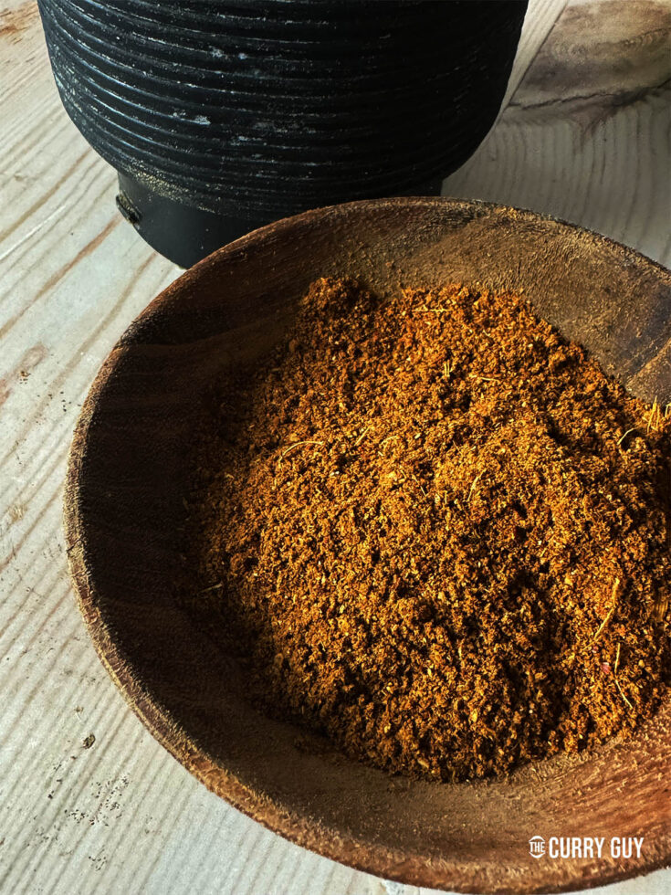 Dhansak masala in a wooden bowl.