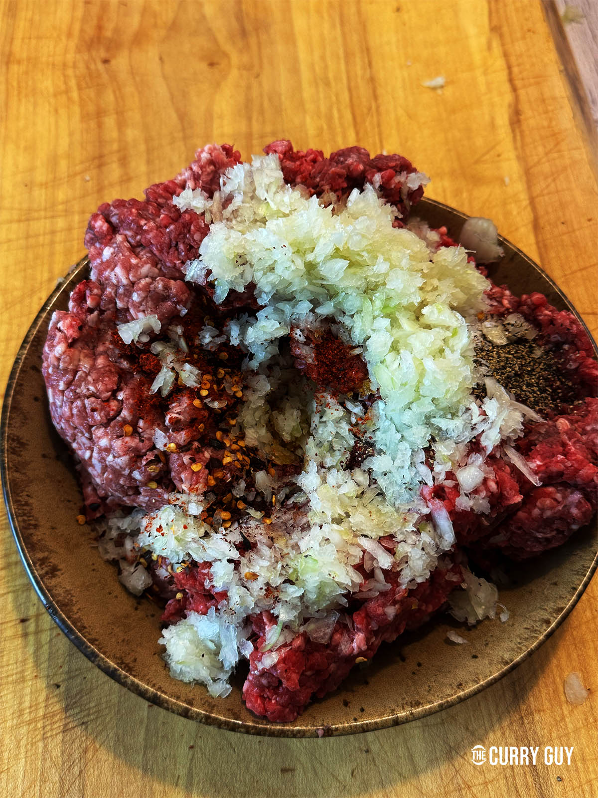 Combining all of the ingredients except for the ghee/butter and onion juice which will be used later for basting.