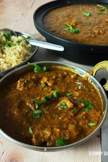 Lamb dhansak in a serving bowl with brown rice.