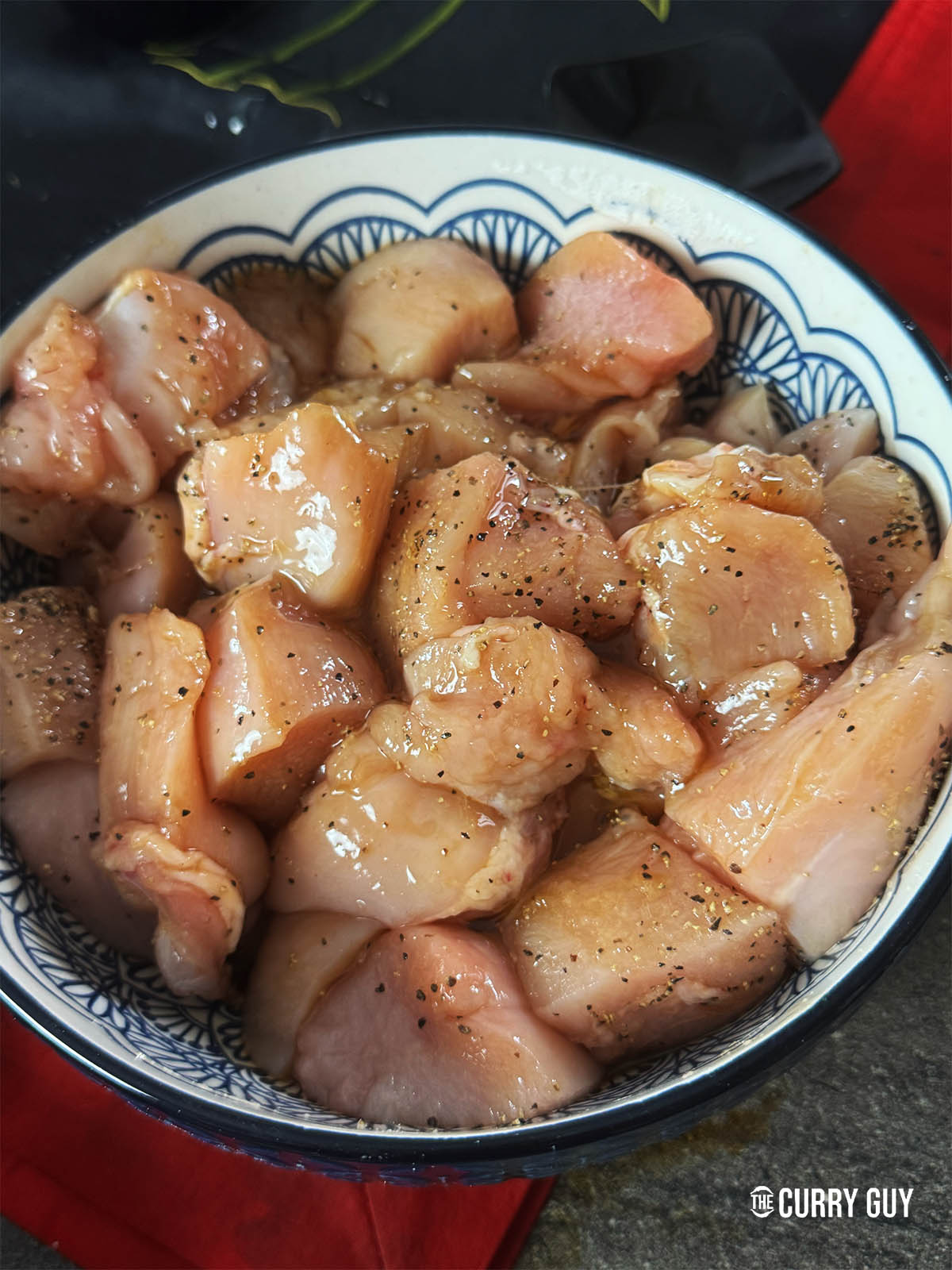 Mixing the marinade right into the chicken.