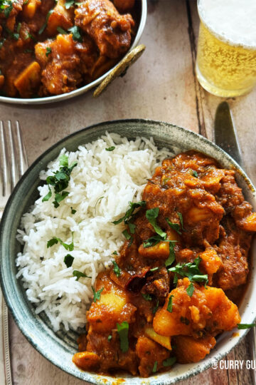 Sylheti chicken curry in a serving bowl with rice