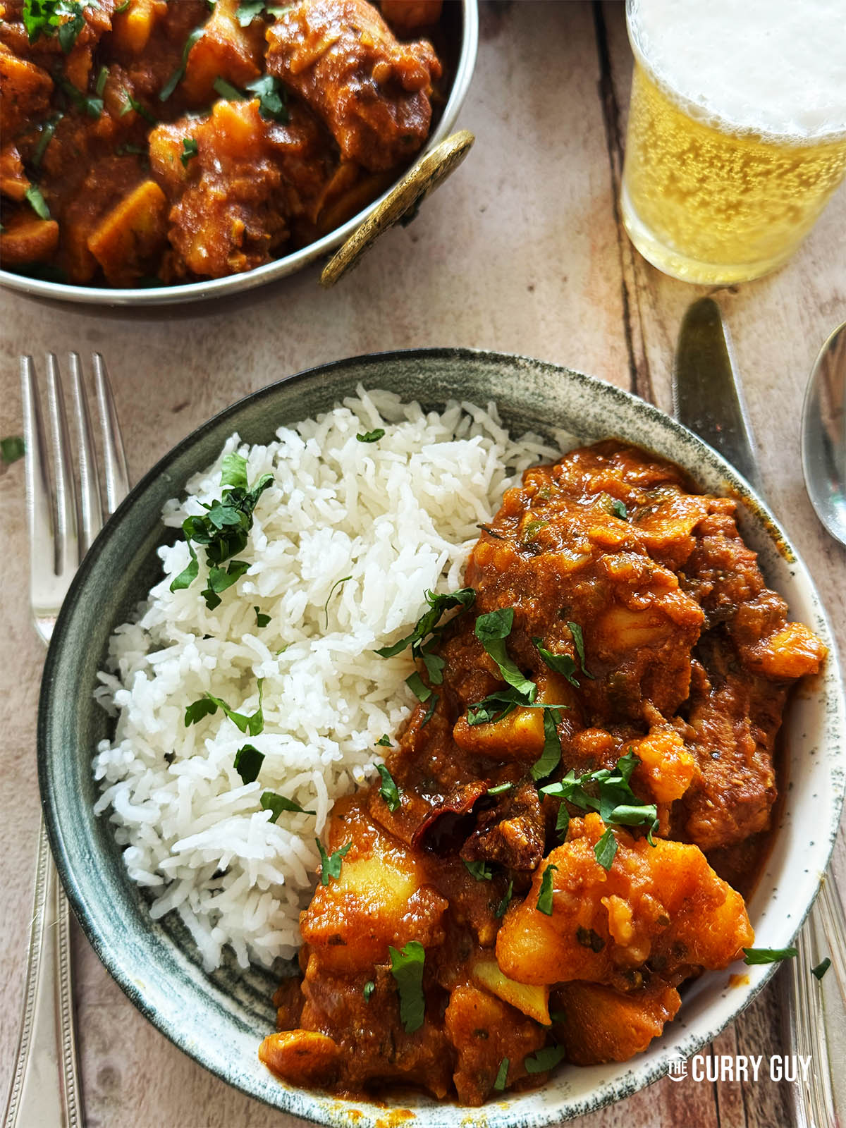Sylheti chicken curry in a serving bowl with rice