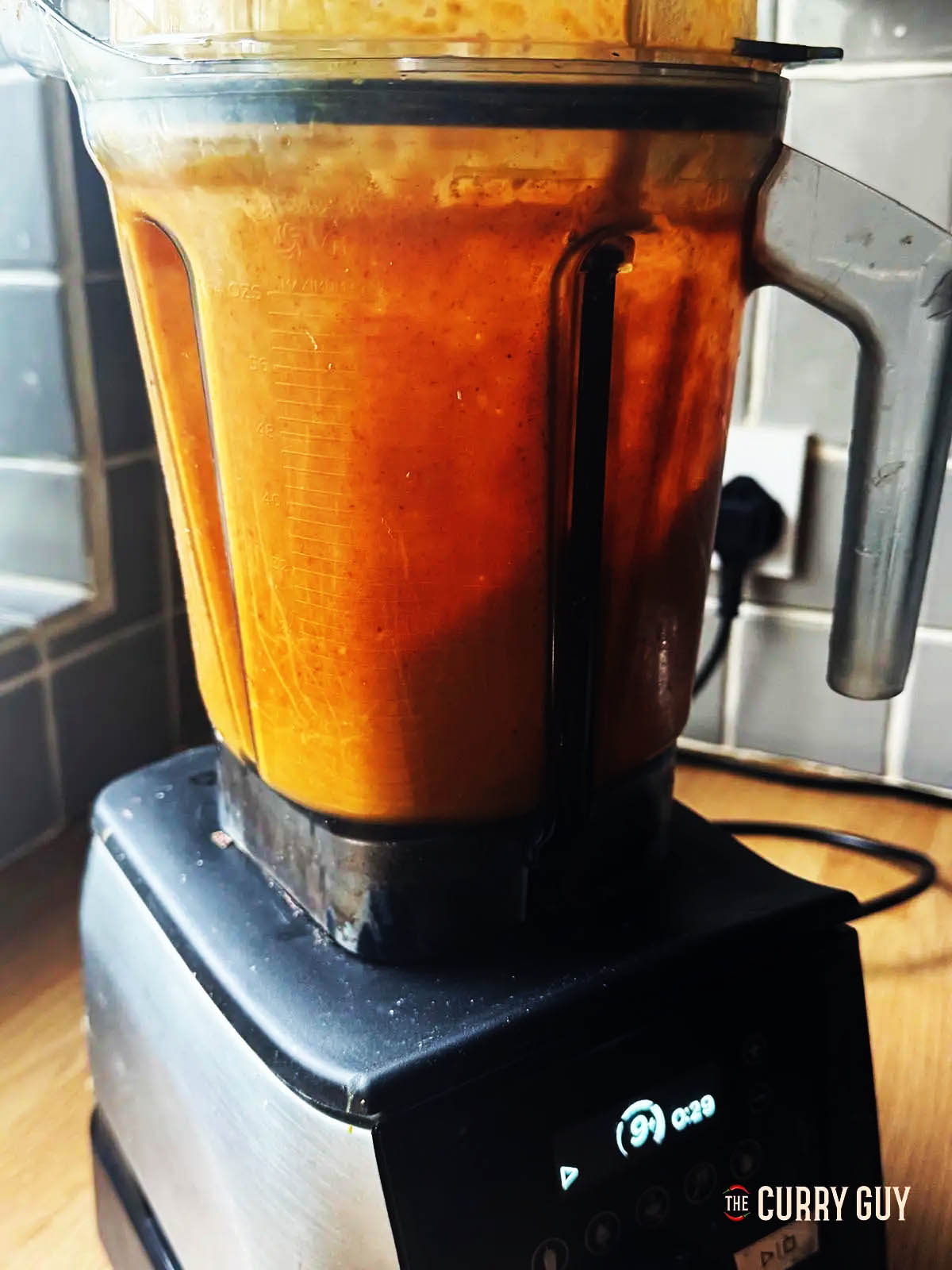 Blending the sauce until smooth in a blender.