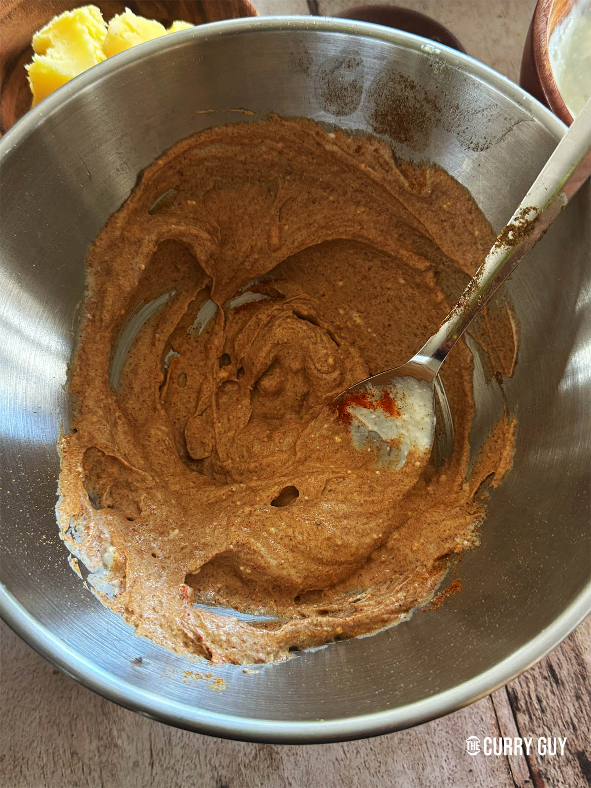 Mixing the marinade ingredients together in a mixing bowl. 