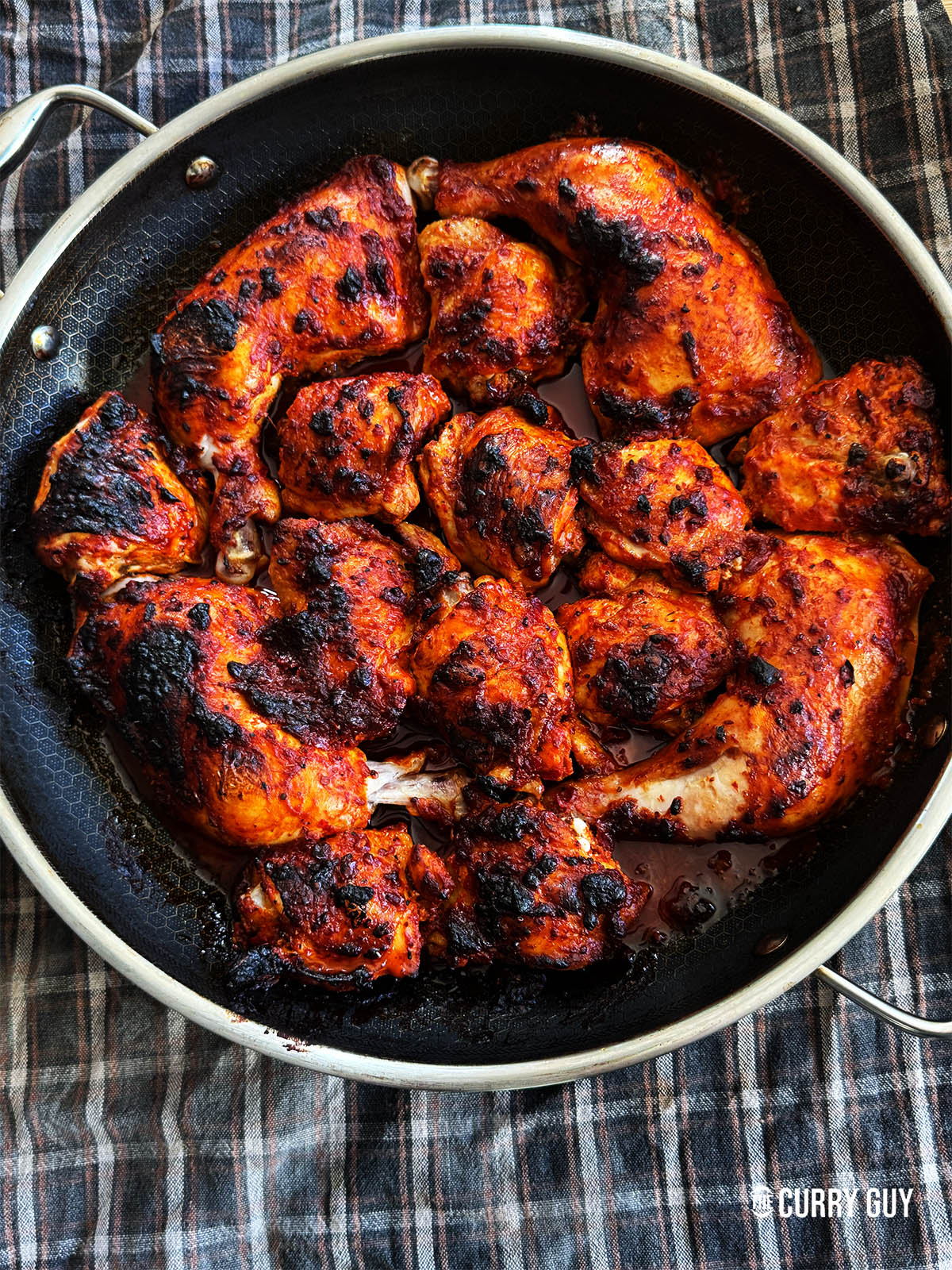 Harissa chicken in the pan it was cooked in.