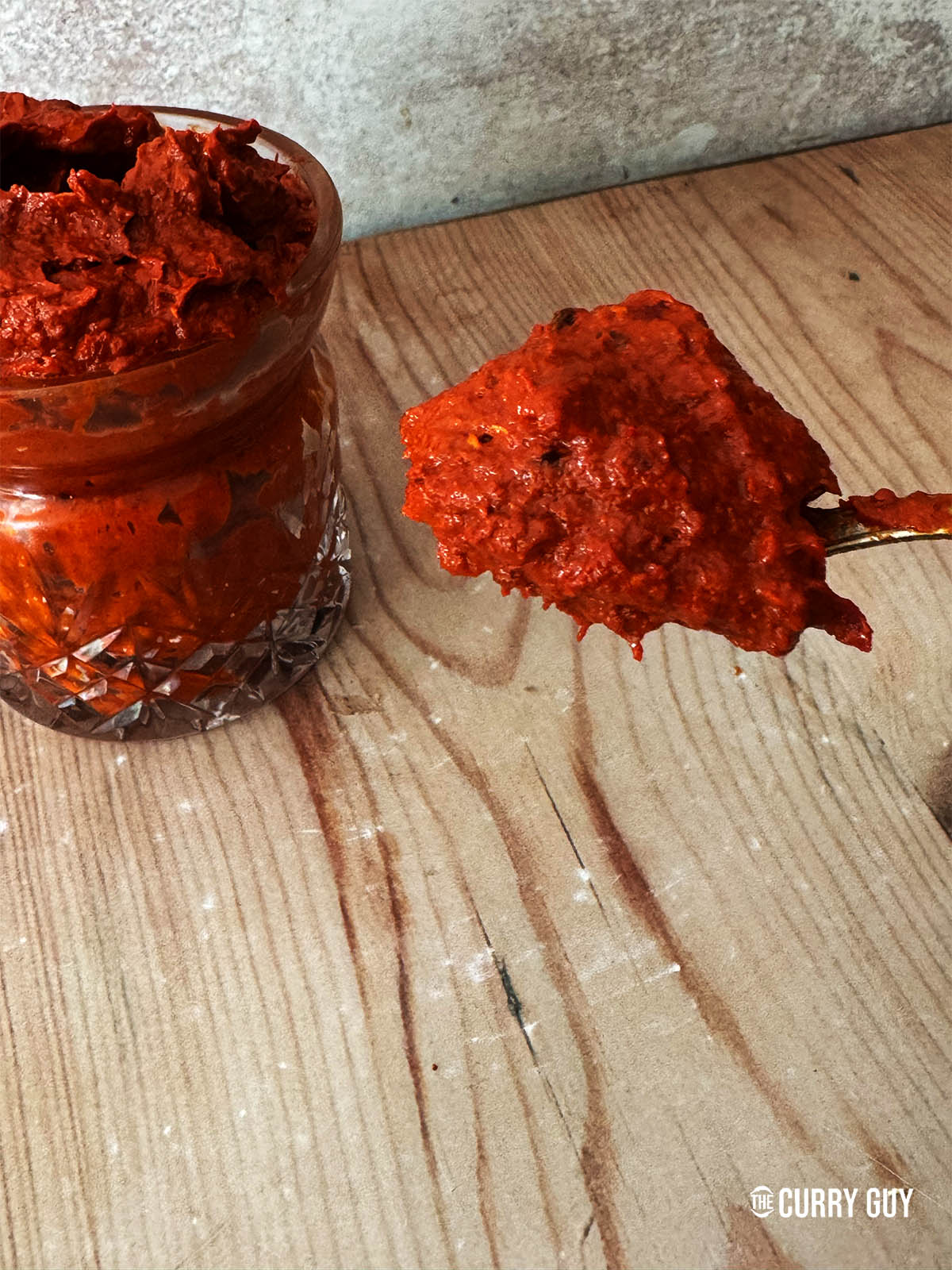 The finished harissa on a spoon.