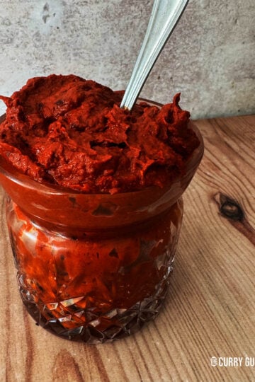 Harissa paste in a glass jar.