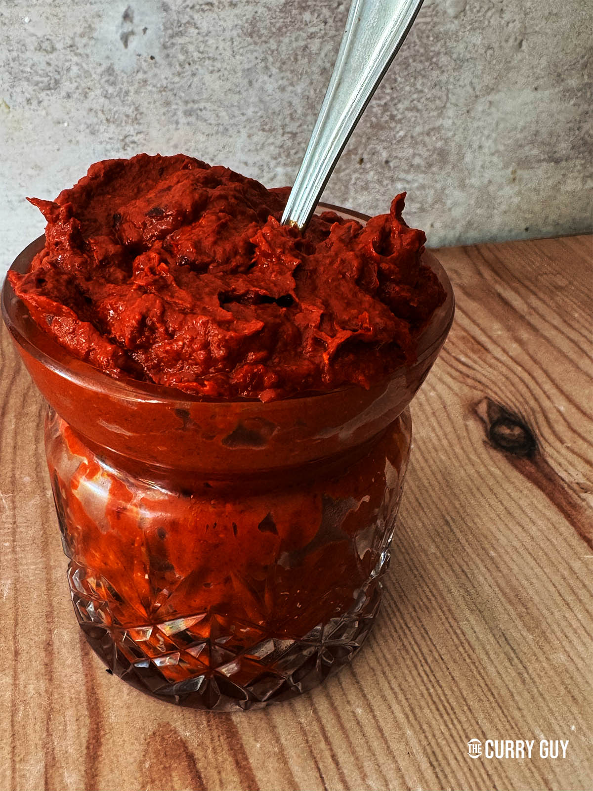 Harissa paste in a glass jar.