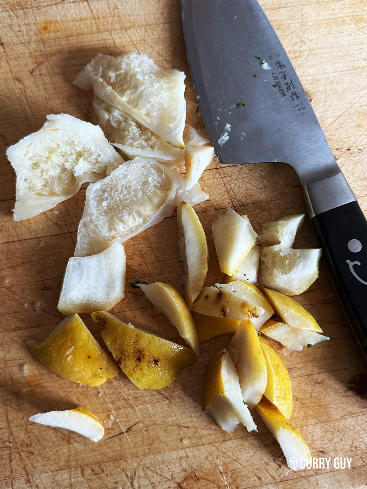 The shatkora washed and then the rind sliced into small pieces.