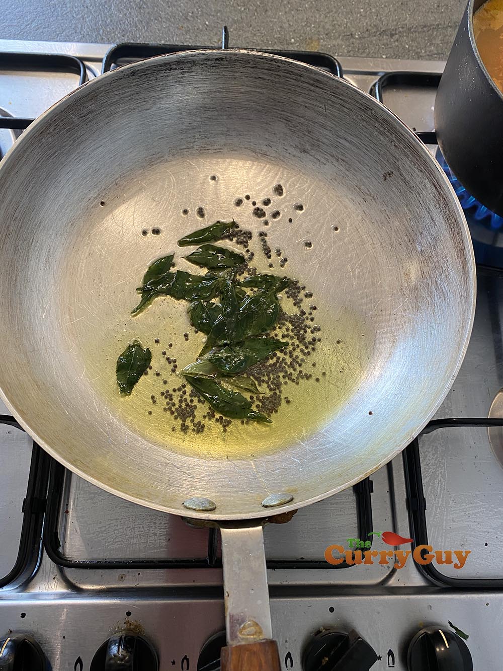 frying whole spices for prawn pathia