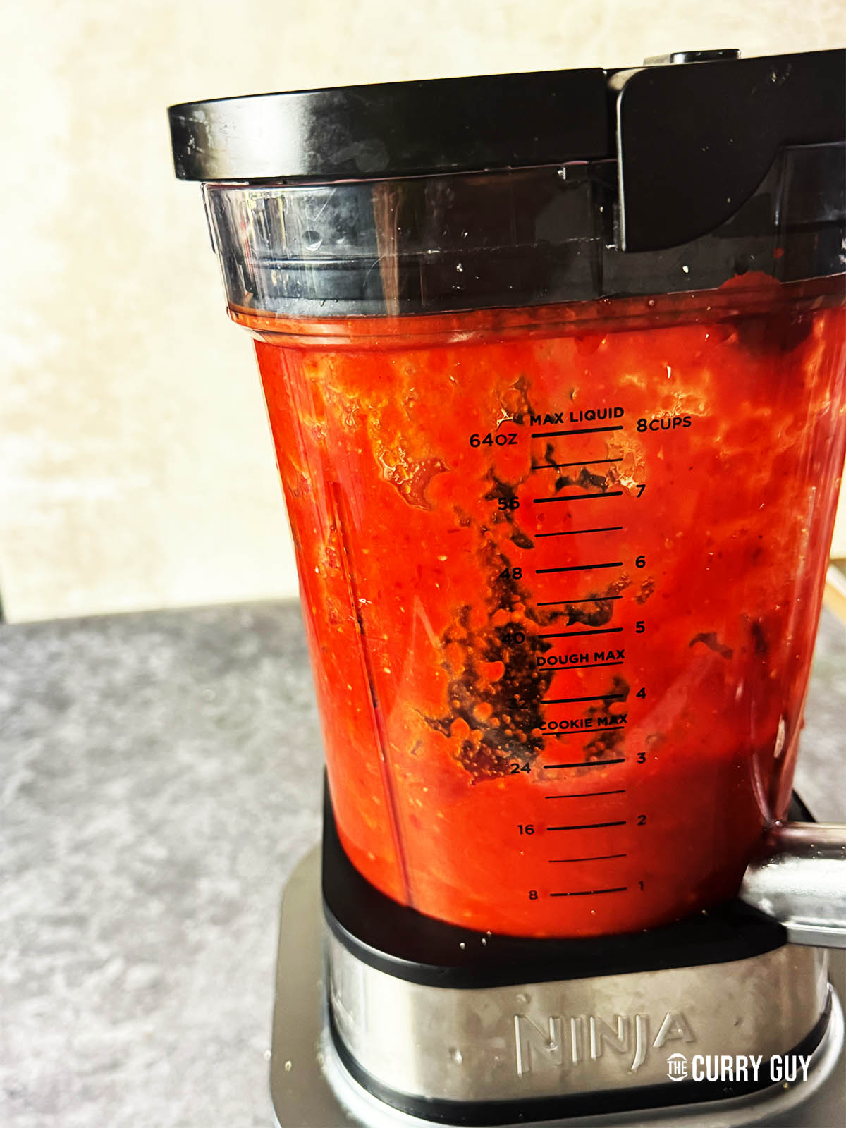 Blending the sauce ingredients until smooth.