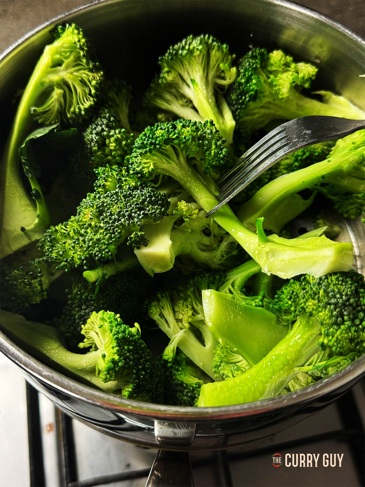 Broccoli steaming in a steamer.