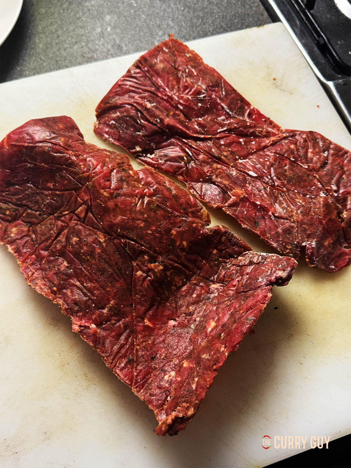 The flattened meat from the freezer bags ready for sliciing.
