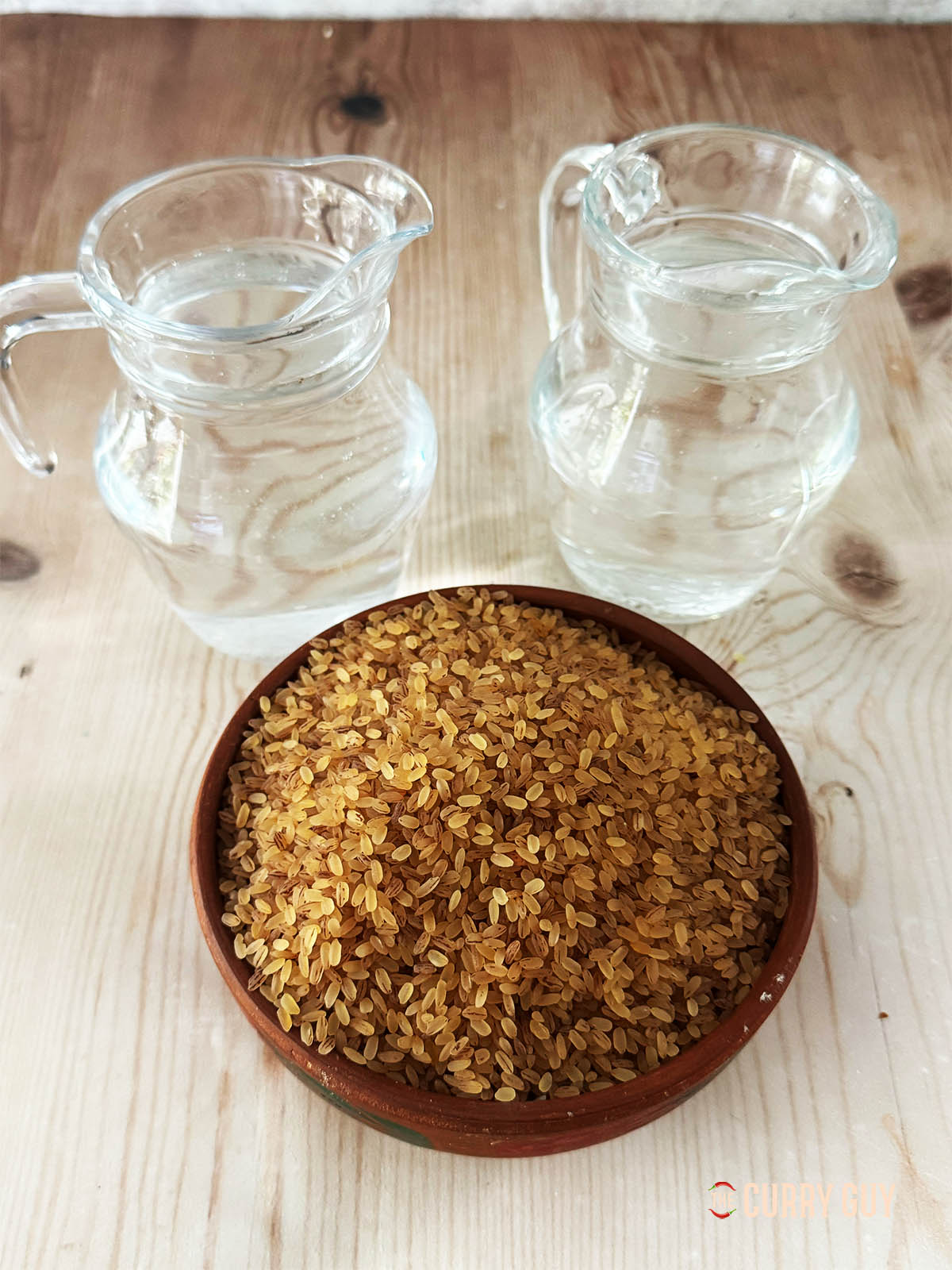 Ingredients to make Matta rice on a countertop.