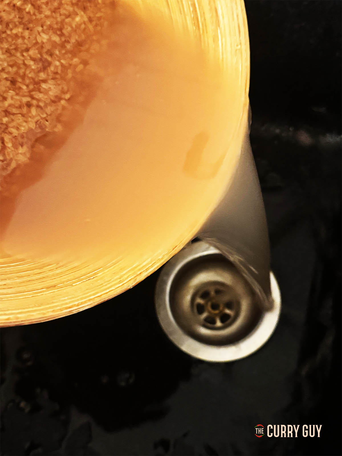 Straining the rice before cooking.