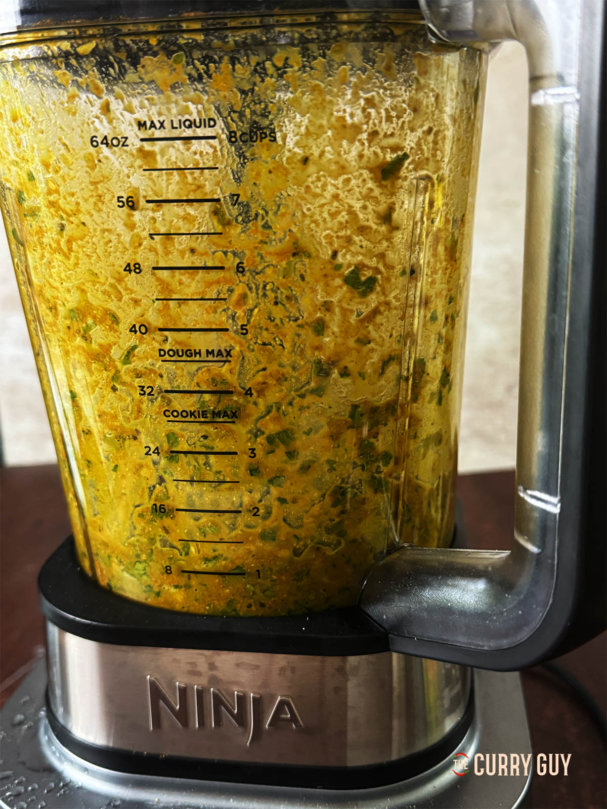 Blending the spice paste in a blender.