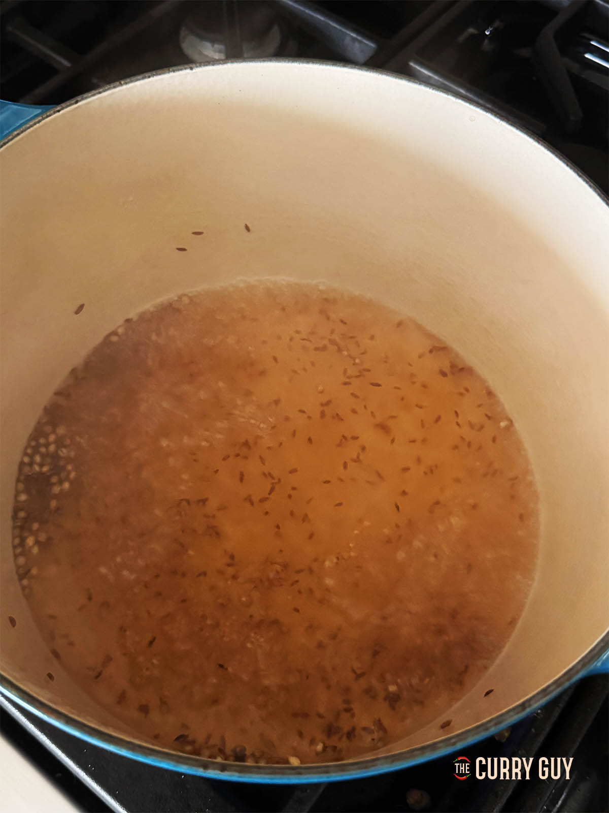 The brine simmering with spices.