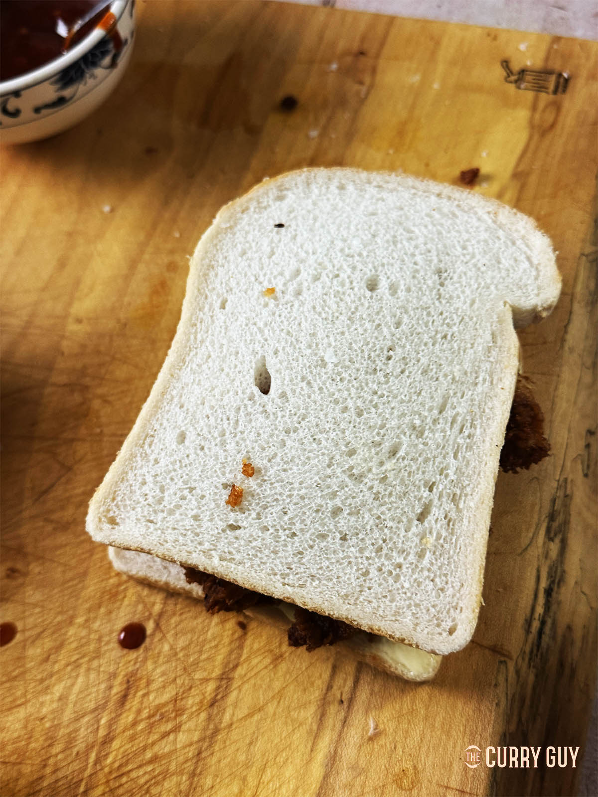 Topping the sando with a slice of bread.