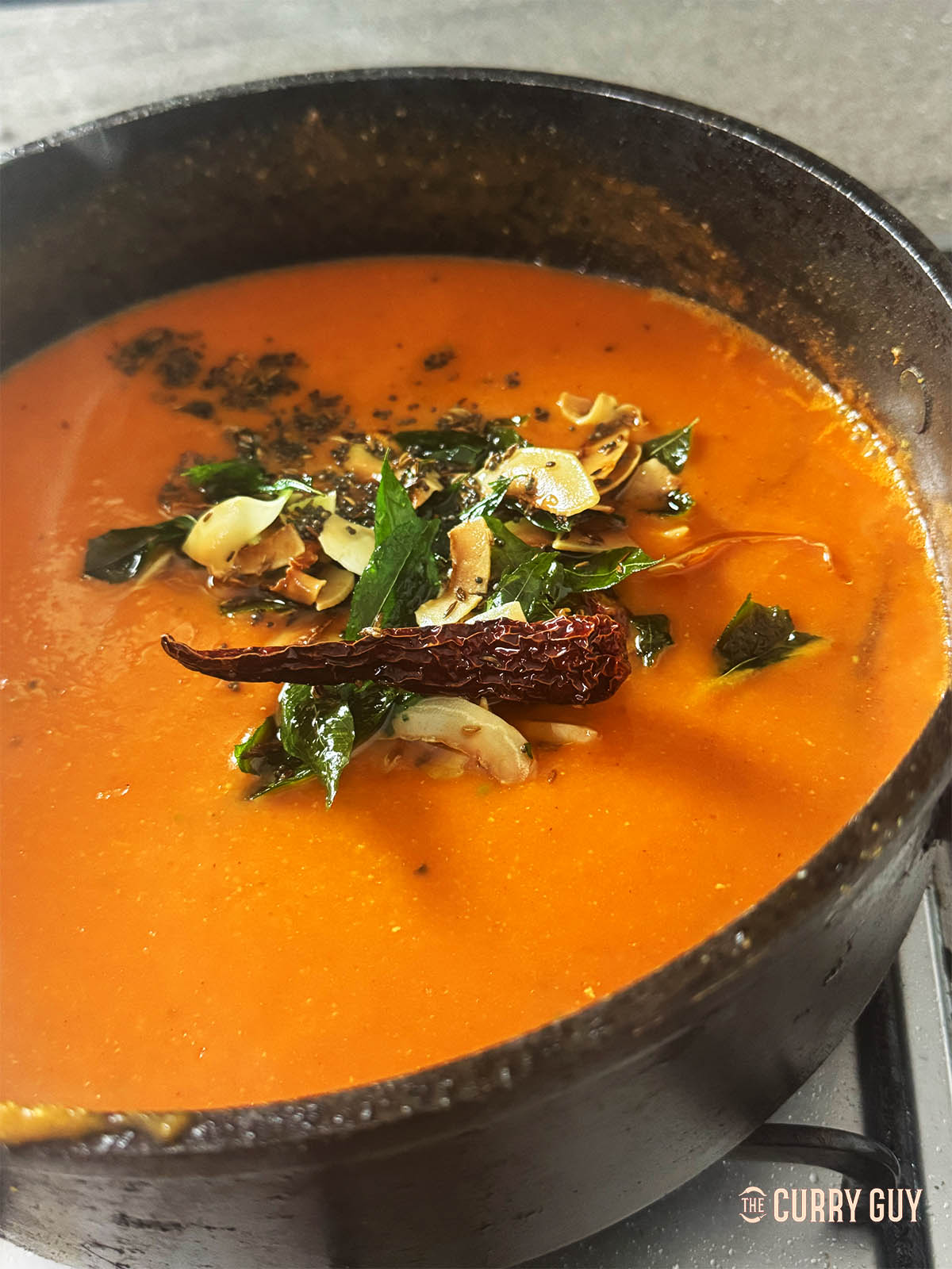 Pour the tarka over the spicy tomato soup just before serving. 