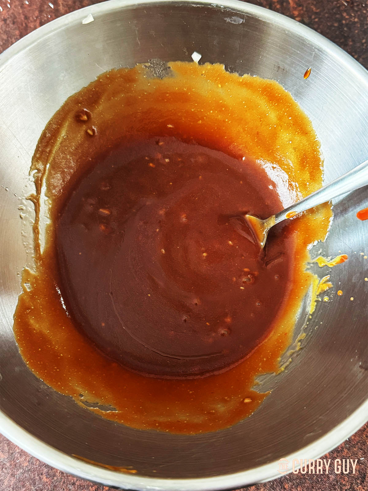Whisking the ingredients together in the mixing bowl. 