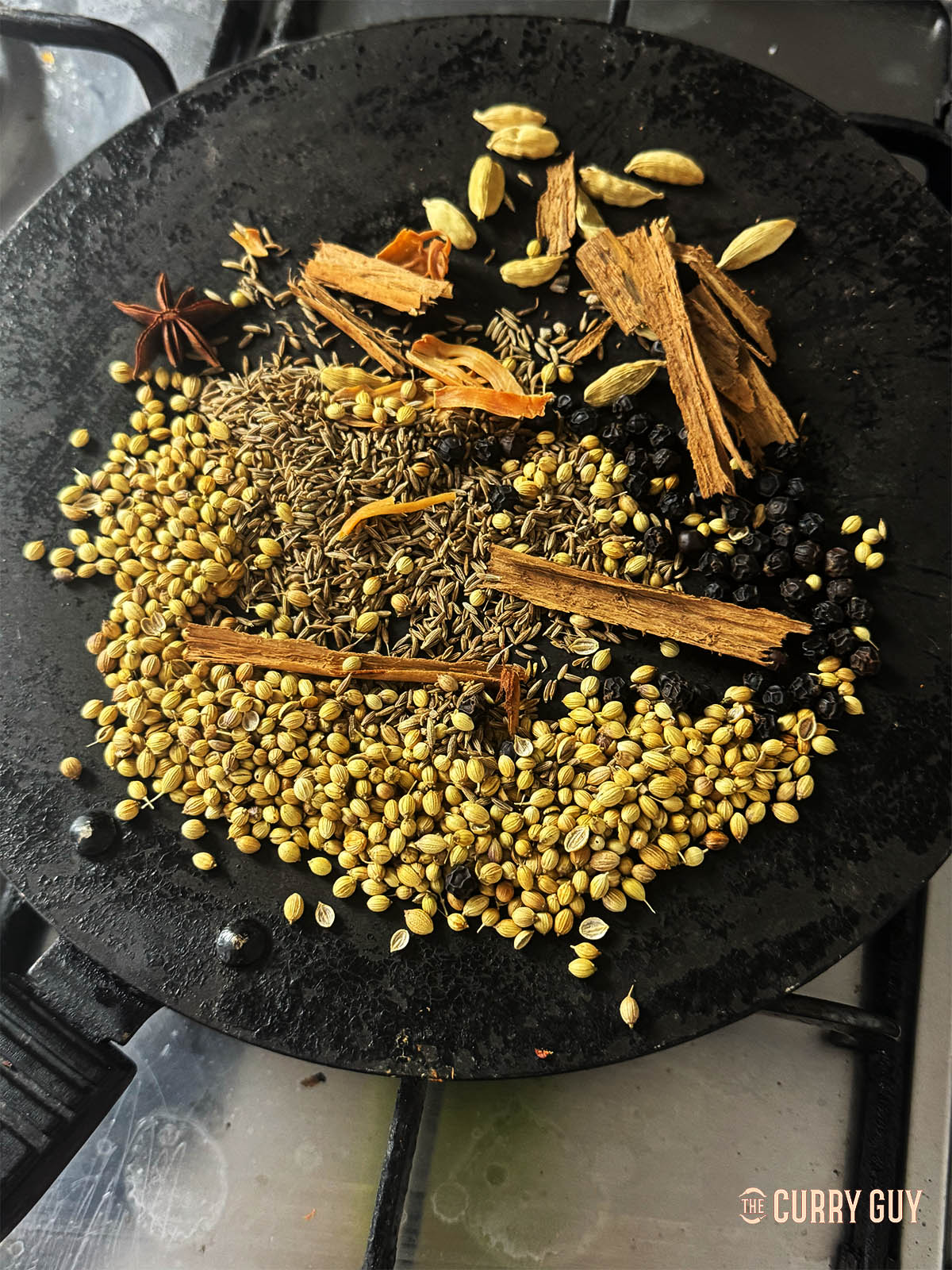 Toasting the whole spice in a pan before grinding.
