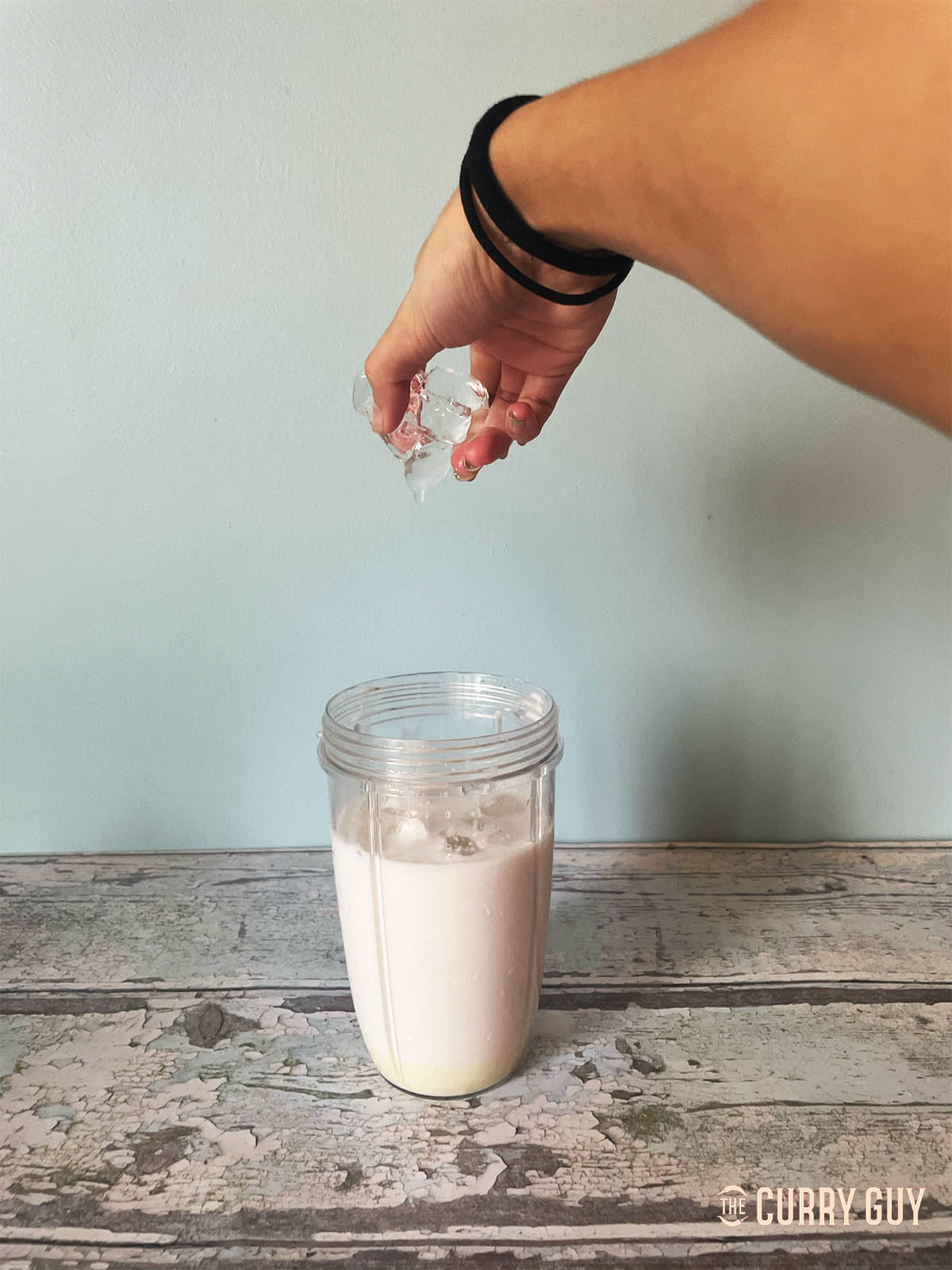 Adding the ice to the blender.