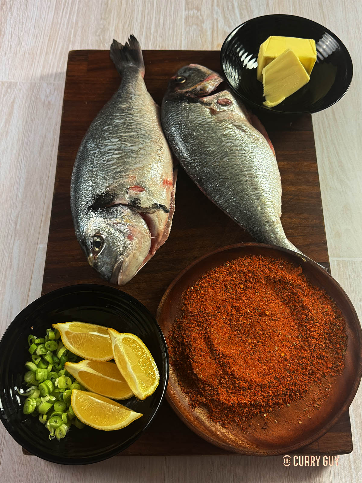 The ingredients for the recipe on a cutting board.