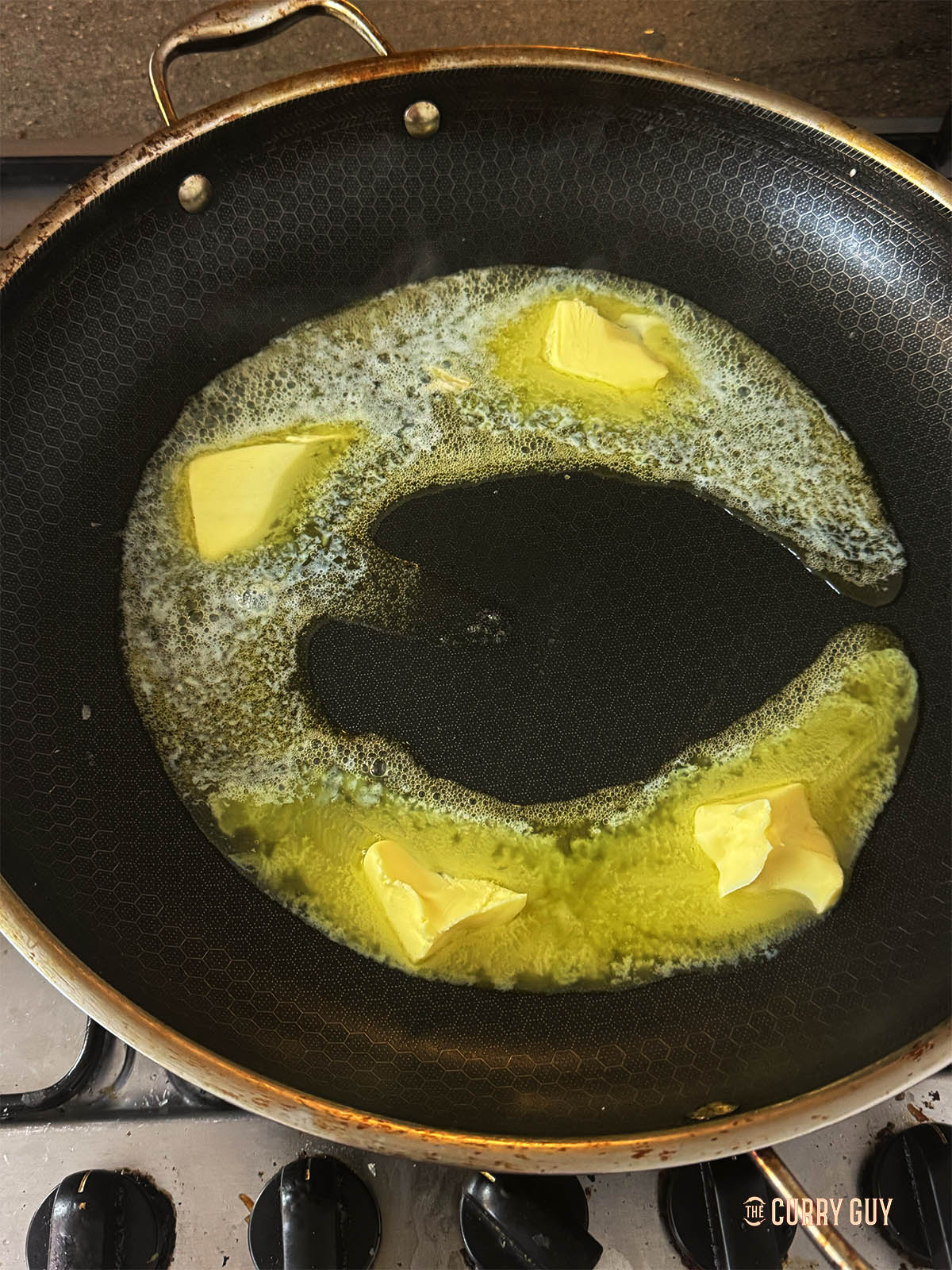 Melting butter in a pan.