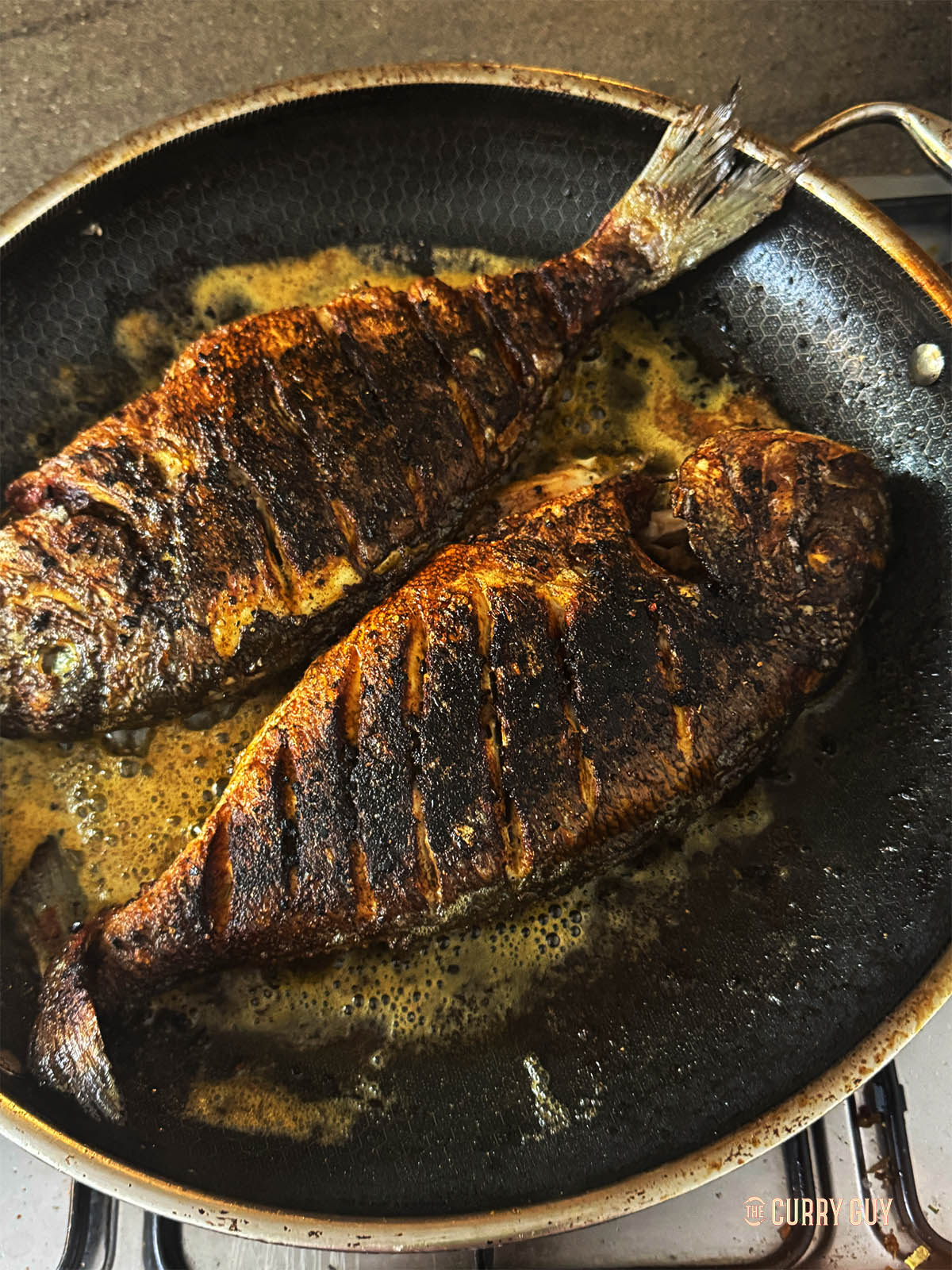 Frying the Cajun fish in the pan.