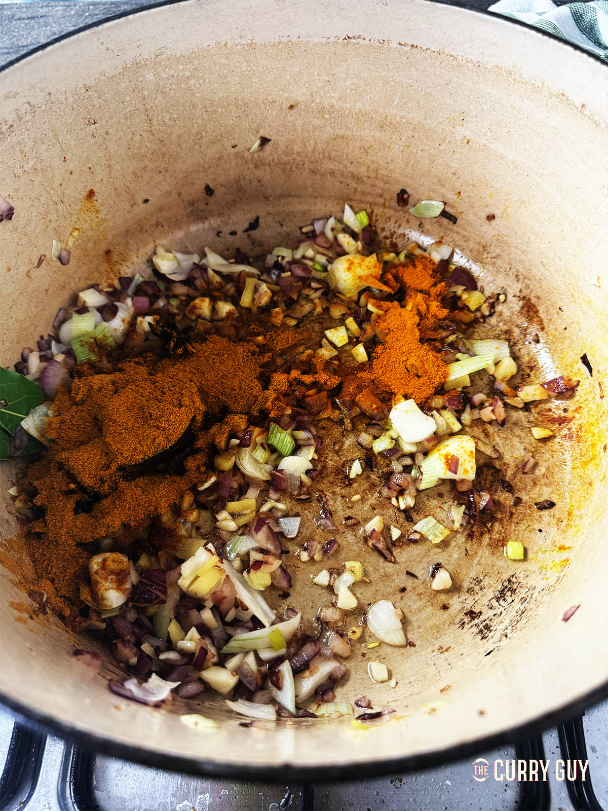 Adding the curry powder and ground turmeric.