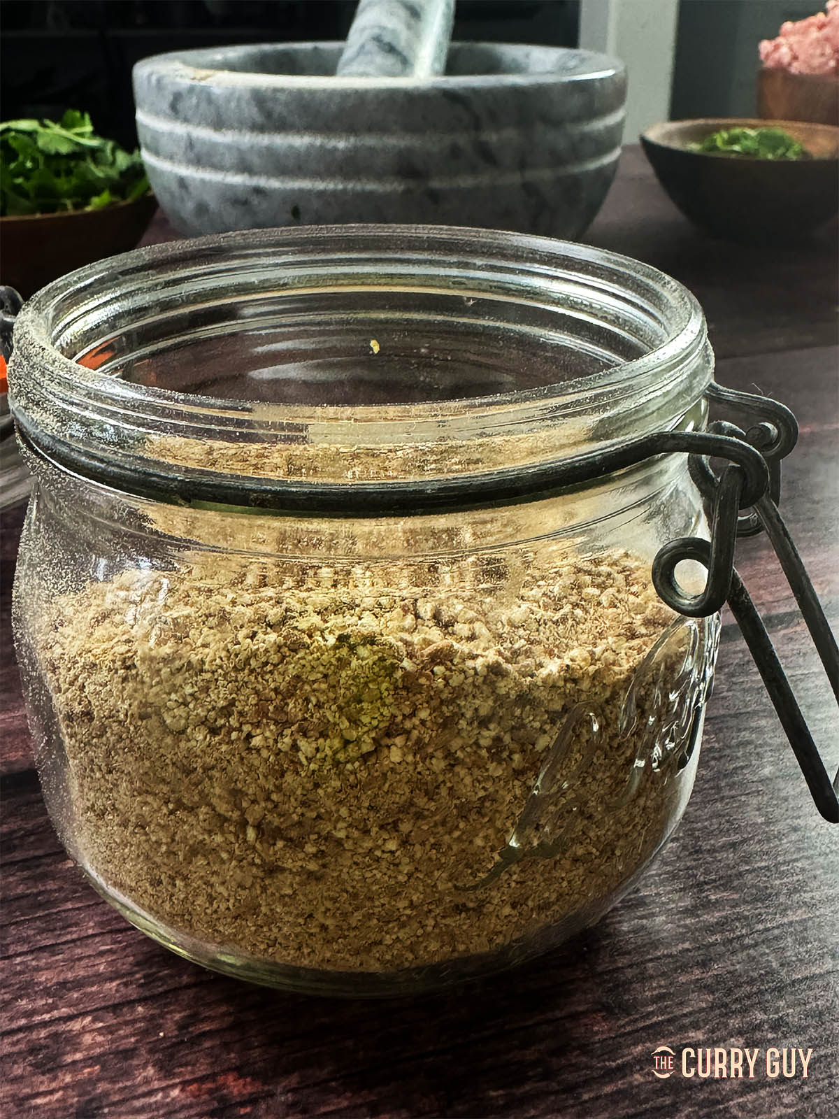 Khoa khua in a glass storage jar.