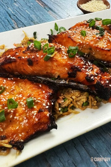 Miso salmon served on a bed of fried rice.